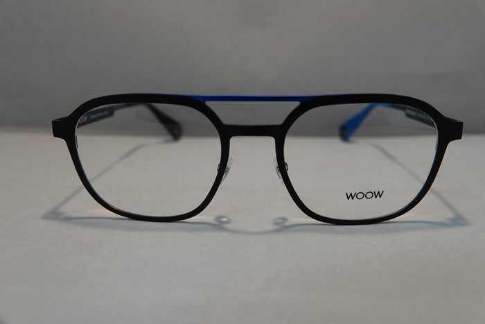 Black full-rim eyeglasses with a thin blue metal bridge and blue temple tips, featuring the WOOW brand name printed on the lower right lens, set against a neutral gray background.